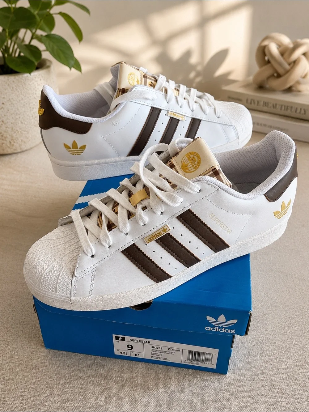 Adidas Superstar White Sneaker with Brown Stripes and Gold Accents